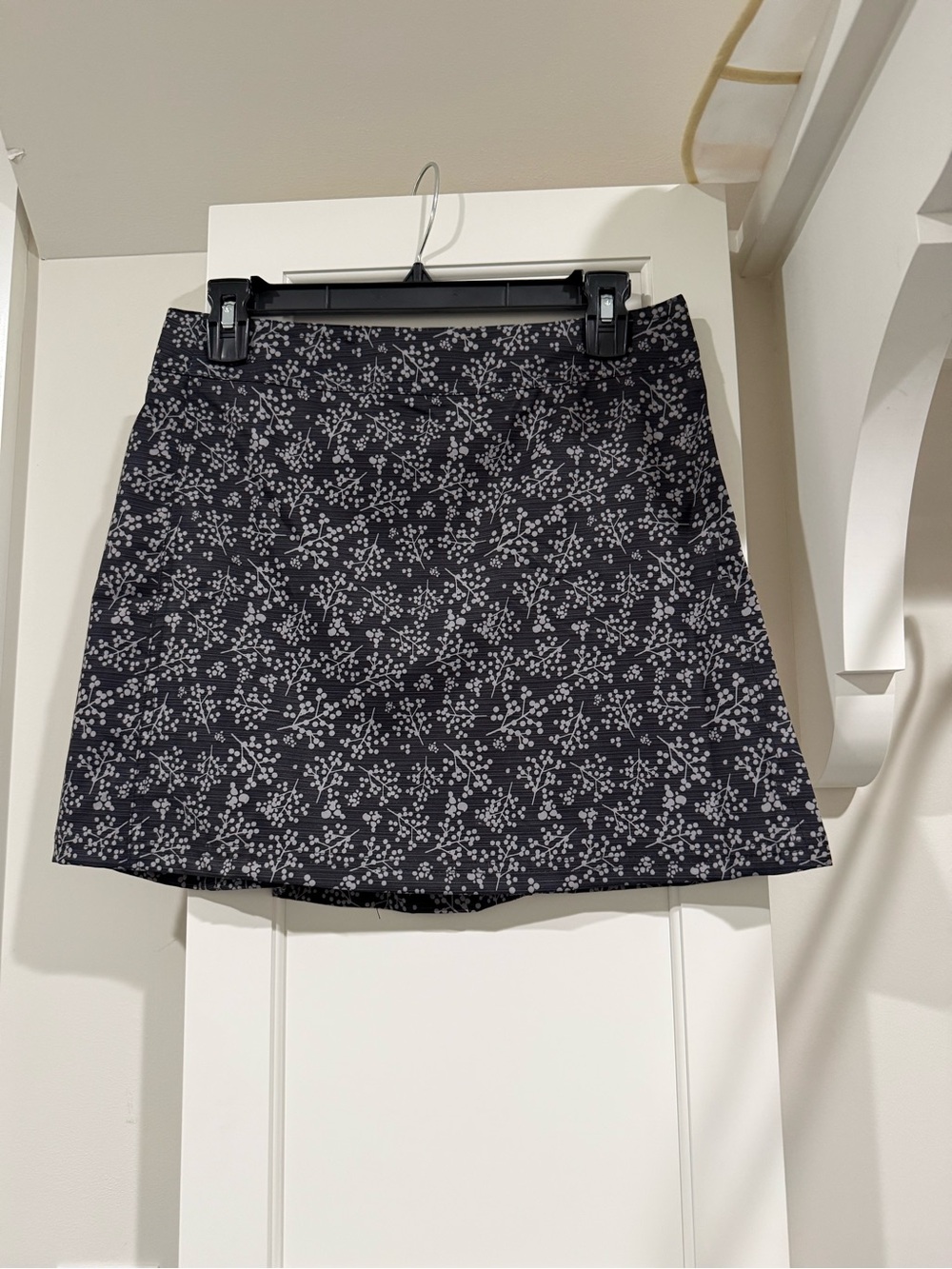Ripskirt Hawaii Black Mini Skirt with Light Gray Floral Scatter
